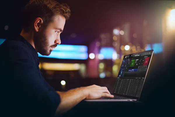 A cheerful woman in traditional clothing using her smartphone during a festive moment, showing how easily the SPINARA app fits into everyday life.