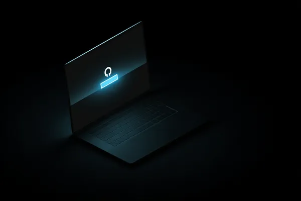 A laptop glowing with a bright login prompt in a minimalistic setup, symbolizing the protected access system at SPINARA.